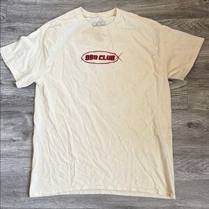 999 Club Short Sleeve Graphic Tee in Cream with Red Logo